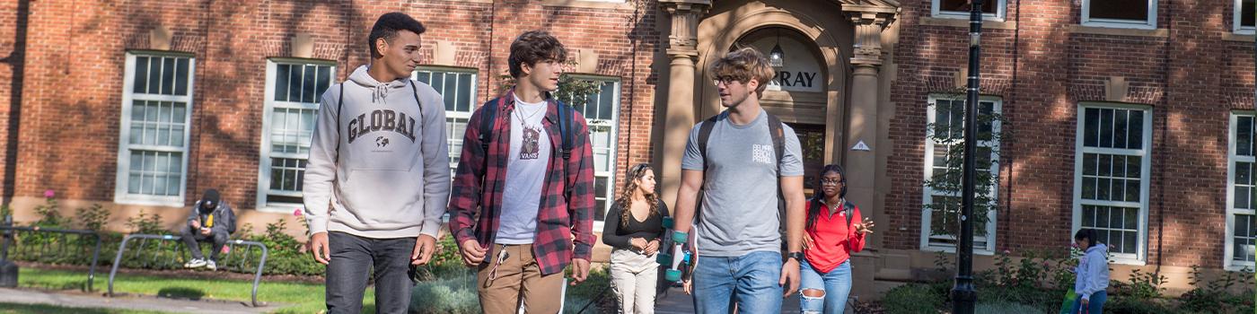 Students walking on campus talking